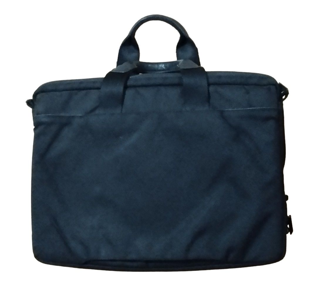 Tumi T-tech bag (Category: Briefcases) located in Las Pinas. Submitted by 05.11minimalist (Listing ID 1258387394, Image 2). Description: Tumi T-tech laptop bag. Black. Ballistic nylon. Dimensions: 12"H x 16"L x 3.5"W. Signed hardware. Leather clad handles. Cushion lined laptop section. Multiple zip and open pockets. No runs, rips or holes. Some minimal paint chips on some zip pullers. In very good condition..