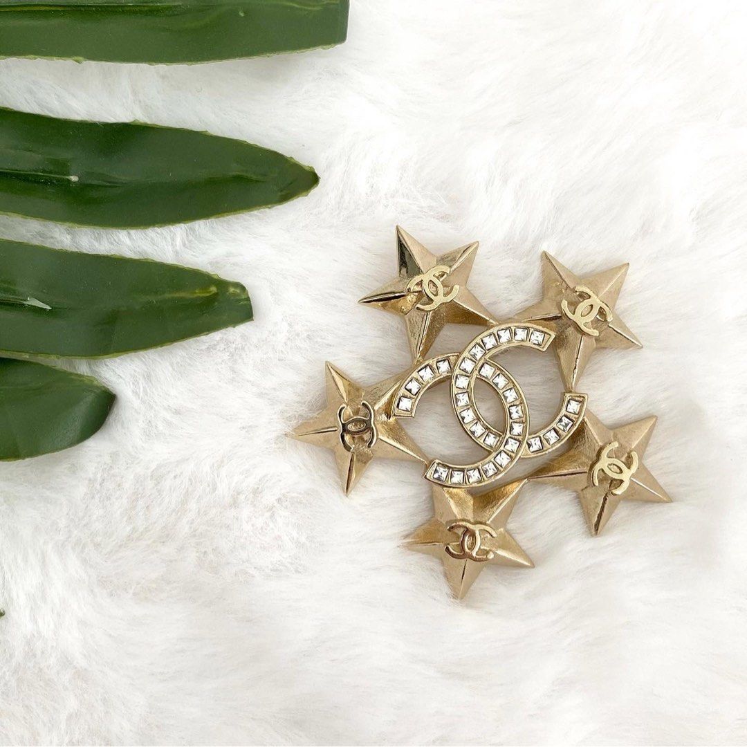 💯% Authentic Chanel Gold Tone Baroque Crystal CC Star Pin Brooch, Luxury,  Accessories on Carousell