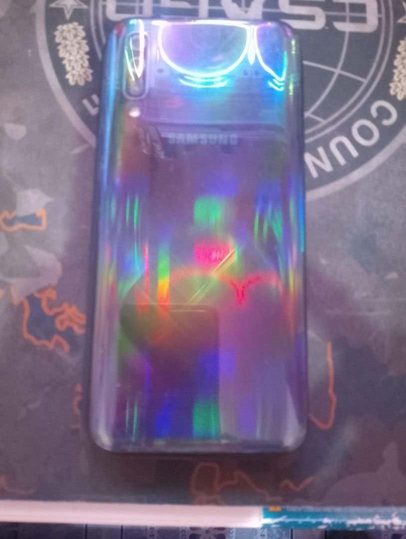 Samsung Galaxy A50 (Black) 128gb/4gb (Category: Samsung) located in Marikina City. Submitted by mrklstrr (Listing ID 1258649732, Image 3). Description: Samsung Galaxy A50 (Black) Storage: 128gb RAM: 4gb PACKAGE: -Unit -1 Phone Case ISSUES: -Na open na yung back part ng phone dahil pina ayos ang power button -Mabilis ma low batt -Scratches -Naghahang tapos mag rerestart automatically or minsan iintayin muna ma dead batt sabay charge para bumukas u