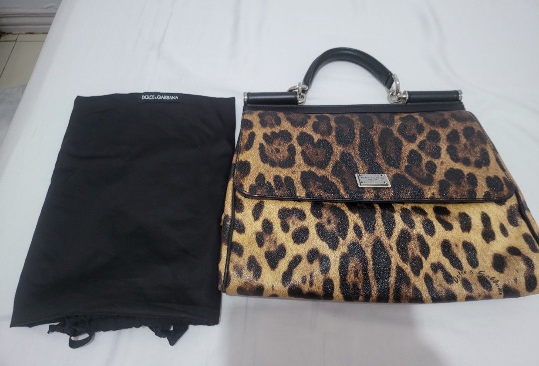 Authentic Dolce and Gabbana Sicily Printed (Category: Luxury Bags & Wallets) located in Manila. Submitted by jml.ecg (Listing ID 1258805940, Image 1). Description: nice for travelling spacious from abu dhabi with sling dustbag and cards flaws noted with white spot at the side barely noticeable bag still in very good condition from 40k doe to 29500.