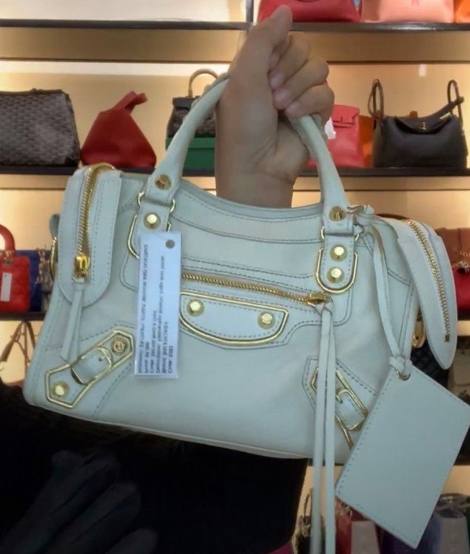 Balenciaga Small (Category: Luxury Bags & Wallets) located in Makati City. Submitted by denvergirl1119 (Listing ID 1258784588, Image 2). Description: Still pretty. Shiny gold hardware with no scrubs & scratches. Looks like new. With dustbag, authenticity cards & paperbag. Brandnew price is 2,200 usd. Authenticity card included.