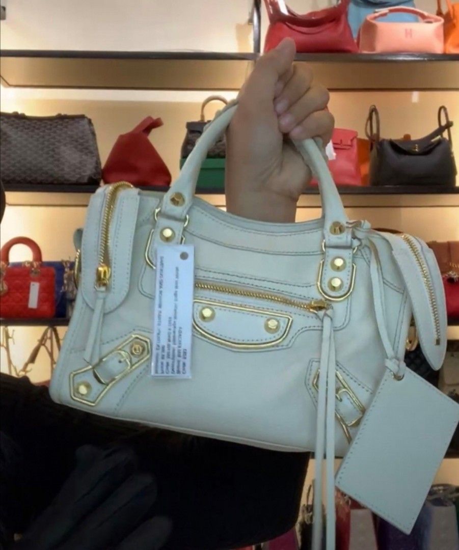 Balenciaga Small (Category: Luxury Bags & Wallets) located in Makati City. Submitted by denvergirl1119 (Listing ID 1258784588, Image 1). Description: Still pretty. Shiny gold hardware with no scrubs & scratches. Looks like new. With dustbag, authenticity cards & paperbag. Brandnew price is 2,200 usd. Authenticity card included.