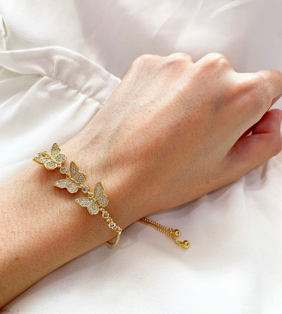Gold bracelet top with butterfly