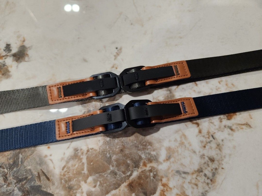 Camera adjustable strap (Category: Cameras) located in Singapore. Submitted by ice_ais (Listing ID 1258977987, Image 3). Description: Adjustable camera strap between 80cm to 120cm. Easy release anchor mechanism. 2 units available army green and deep sea blue..