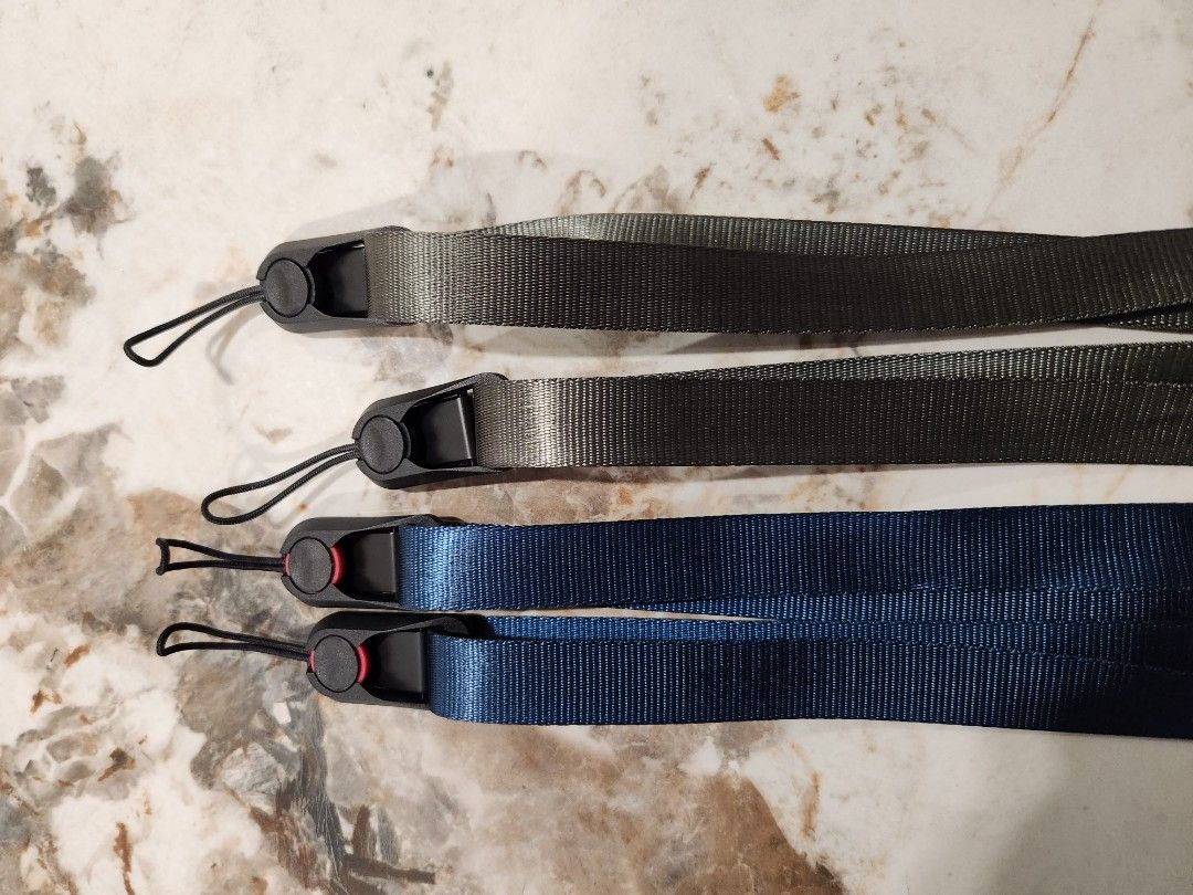 Camera adjustable strap (Category: Cameras) located in Singapore. Submitted by ice_ais (Listing ID 1258977987, Image 1). Description: Adjustable camera strap between 80cm to 120cm. Easy release anchor mechanism. 2 units available army green and deep sea blue..