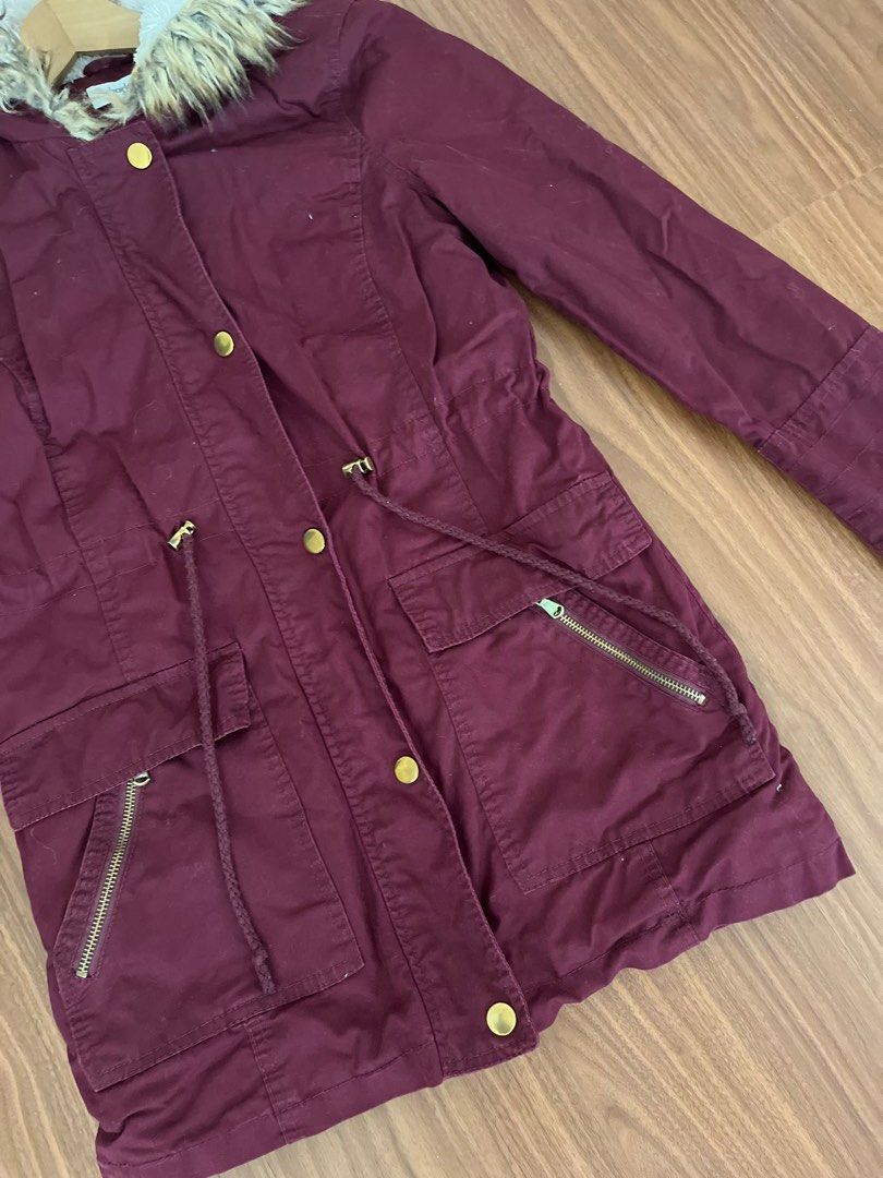 Maroon jacket deals with fur hood