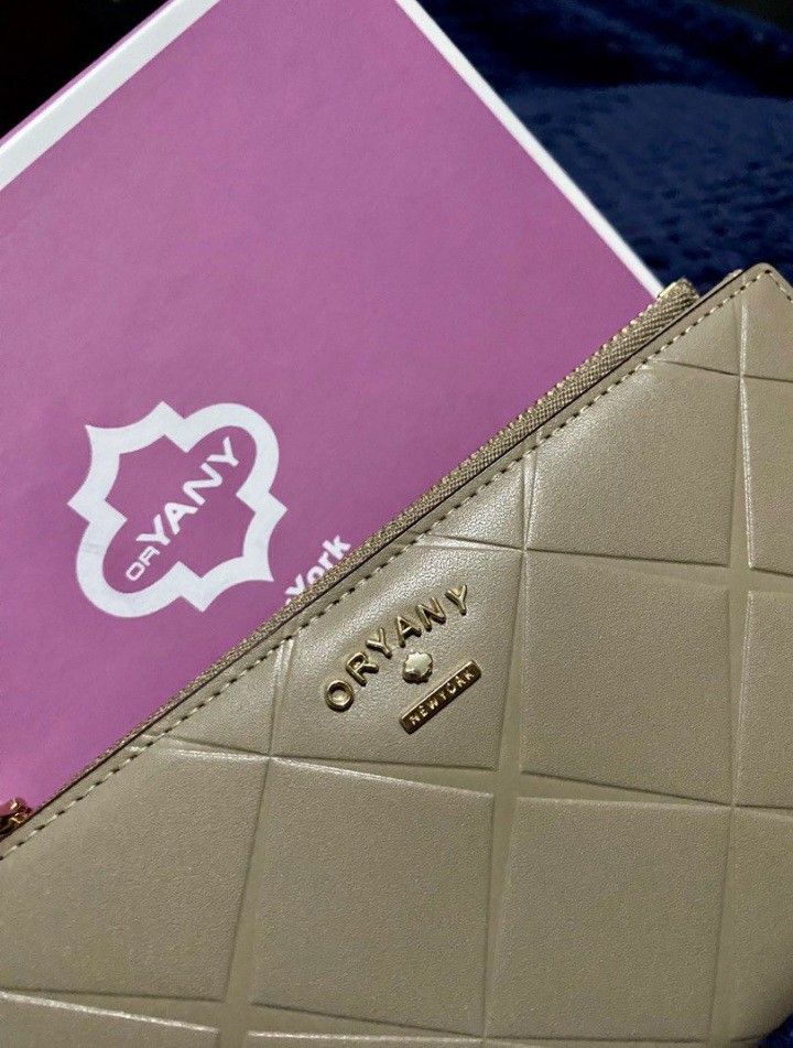 OrYany wallet (Category: Luxury Bags & Wallets) located in Lipa City. Submitted by myrich (Listing ID 1258921150, Image 2). Description: Brand new medium size with box and authenticity card has multiple card slots and picture slot color:beige.