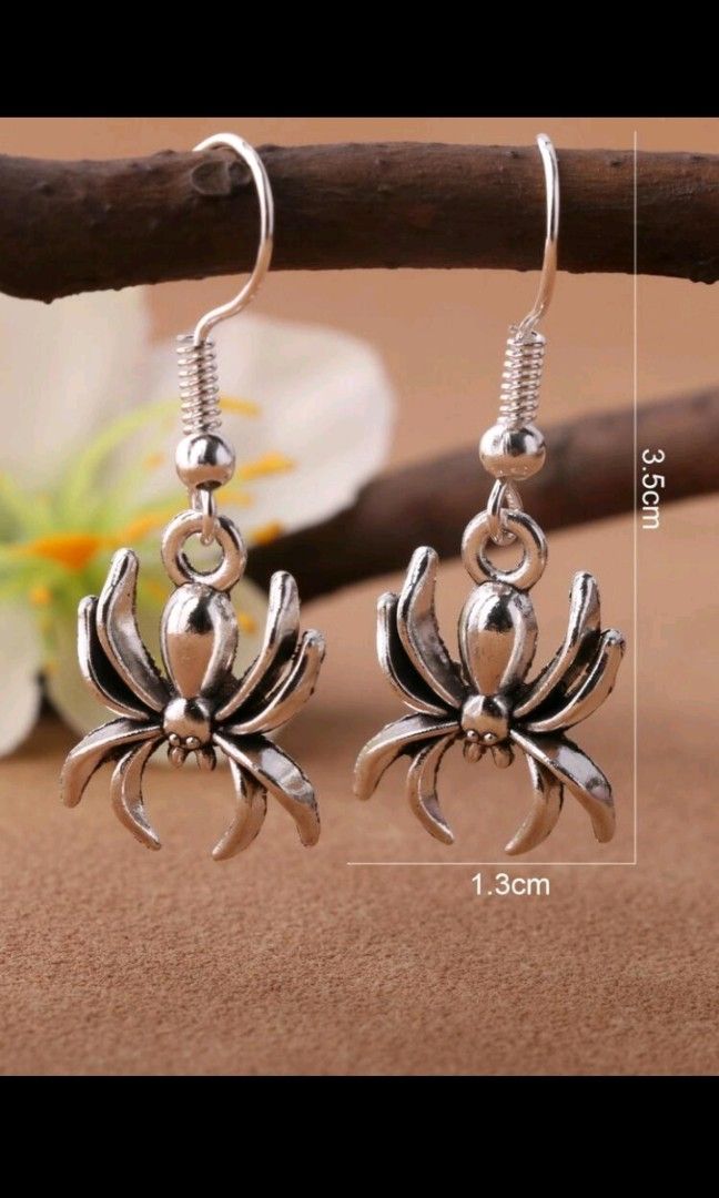 Gold discount spider earrings