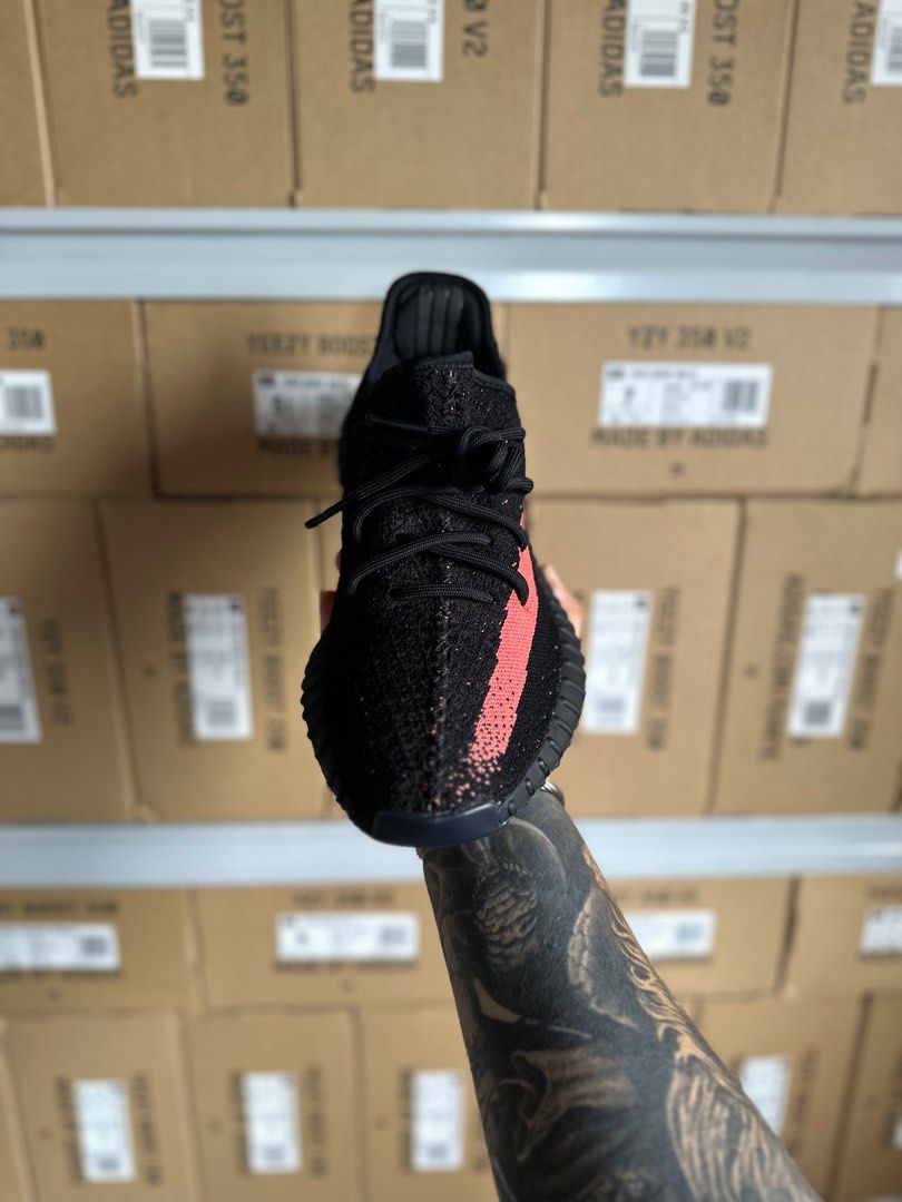 Yeezy red deals stripe on feet