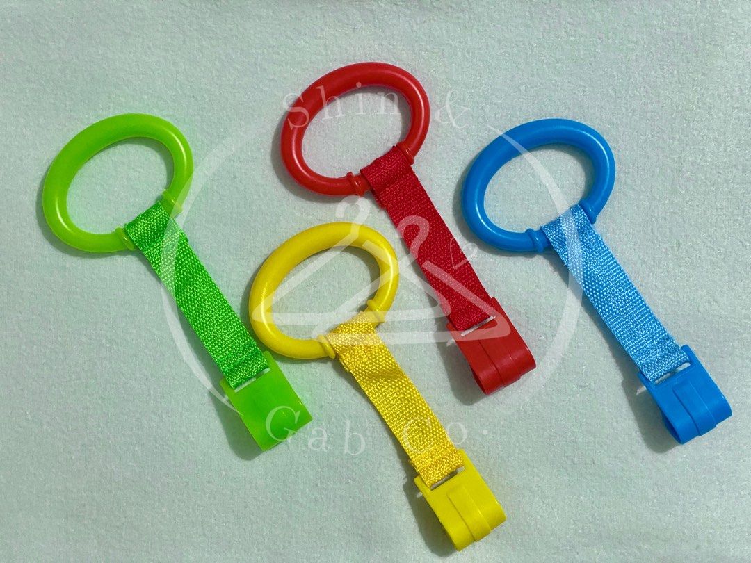 Baby Crib/Playpen Pull Ring/Bed Accessory 4pcs (Category: Infant Playtime) located in Santa Rosa. Submitted by shingabco (Listing ID 1259197802, Image 2). Description: [Actual photos posted for reference.] ***Of great help sa baby ko.*** RFS: Decluttering Material: Plastic Color: Red, Yellow, Blue, Green Function: Helps the baby to achive another milestone; to stand up. Already washed and cleaned. Ready to use. Note: *Colors may vary due to light
