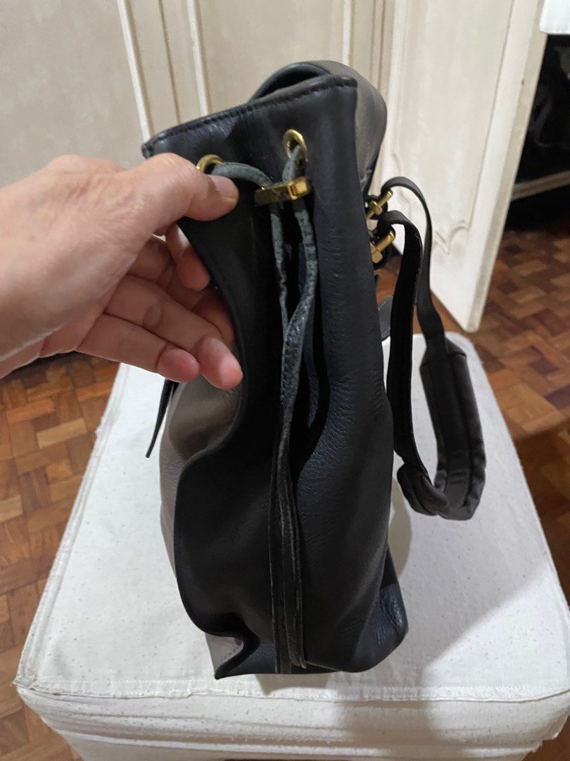 Sling bag/shoulder bag (Category: Luxury Bags & Wallets) located in Quezon City. Submitted by deadmit (Listing ID 1259262524, Image 2). Description: Leather Still in very good condition except for the strings on the side… Size 16”x 12” Taupe with black. Very spacious and beautiful leather.