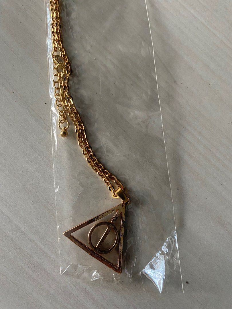 Deathly Hallows necklace gold, Women's Fashion, Watches & Accessories,  Other Accessories on Carousell