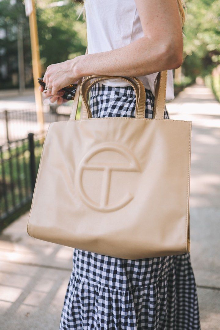 Telfar Medium Tote (Category: Luxury Bags & Wallets) located in Taguig. Submitted by sourcedbym (Listing ID 1259198986, Image 1). Description: Comes with dust bag. Condition: 9.5 Dimensions: Height 11 1/4”, Width 15”, Depth 5”, Strap Drop 21”, Handle Drop 5 1/2” Free shipping within mma. .