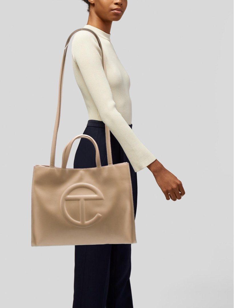 Telfar Medium Tote (Category: Luxury Bags & Wallets) located in Taguig. Submitted by sourcedbym (Listing ID 1259198986, Image 2). Description: Comes with dust bag. Condition: 9.5 Dimensions: Height 11 1/4”, Width 15”, Depth 5”, Strap Drop 21”, Handle Drop 5 1/2” Free shipping within mma. .