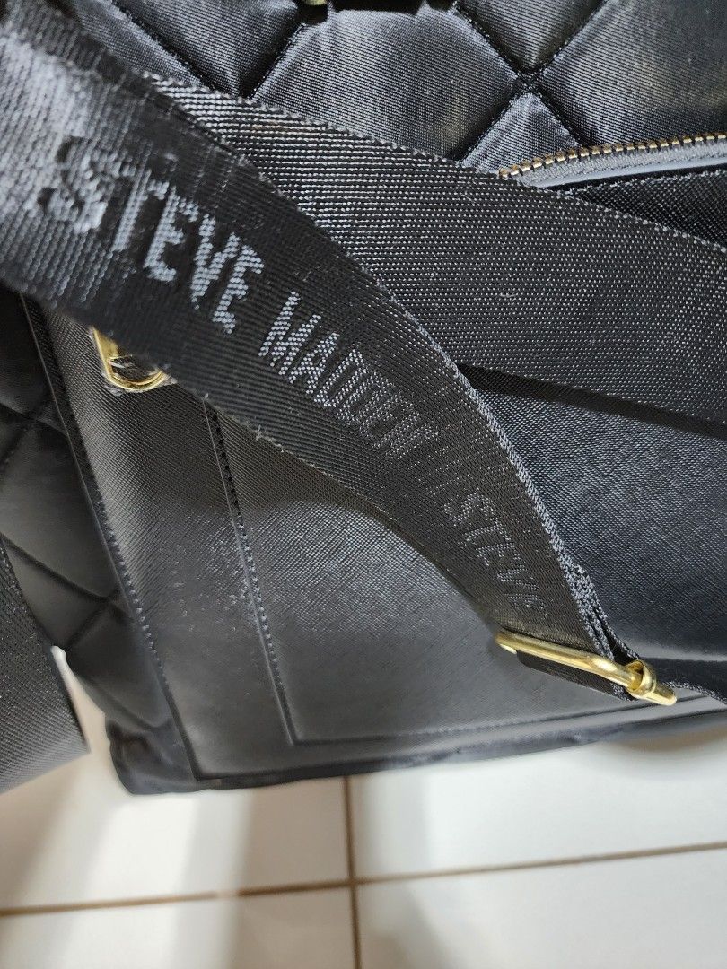 Steve Madden 2-Way Laptop Bag (Category: Laptop Bags & Sleeves) located in Manila. Submitted by firedragon716 (Listing ID 1263314699, Image 3). Description: Steve Madeden Laptop Bag - 100% Authentic, bought from USA - Almost new, uset it 3x only - Material: Quilted nylon for the main body - 3 compartments, 1 outsife pocket, all with zipper. - Hardwares are still gold and very shiny. - Bought brand new for P7,500. Selling it low. - RSF: No use any