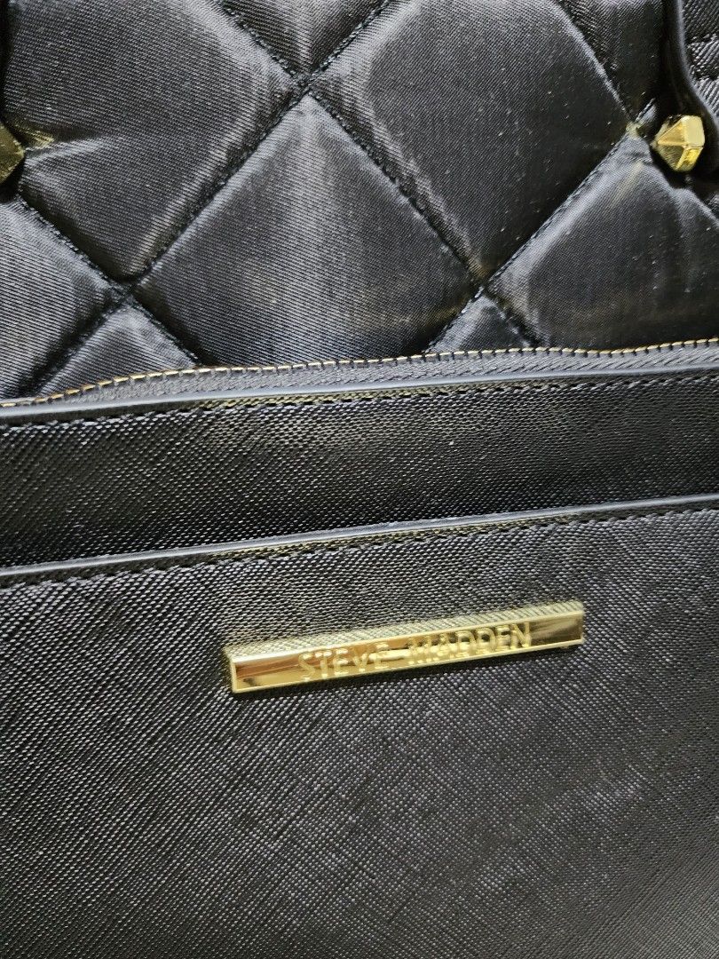 Steve Madden 2-Way Laptop Bag (Category: Laptop Bags & Sleeves) located in Manila. Submitted by firedragon716 (Listing ID 1263314699, Image 2). Description: Steve Madeden Laptop Bag - 100% Authentic, bought from USA - Almost new, uset it 3x only - Material: Quilted nylon for the main body - 3 compartments, 1 outsife pocket, all with zipper. - Hardwares are still gold and very shiny. - Bought brand new for P7,500. Selling it low. - RSF: No use any