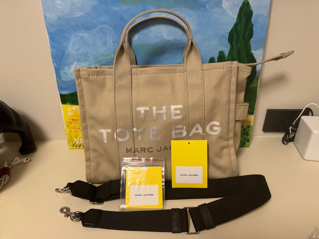 Marc Jacobs The Tote Bag Medium in Canvas (Category: Luxury Bags & Wallets) located in Bulacan. Submitted by krycrez (Listing ID 1264797261, Image 2). Description: Selling my preloved Marc Jacobs The Tote Bag in canvas. Has flaws (please see picture) 13in L x 6in D x 11in H 34cm L x 15cm D x 27cm H Strap 57in L x 2in D (144cm L x 4cm D) Strap Drop 27in (69cm) Handle Drop 5in (12cm).