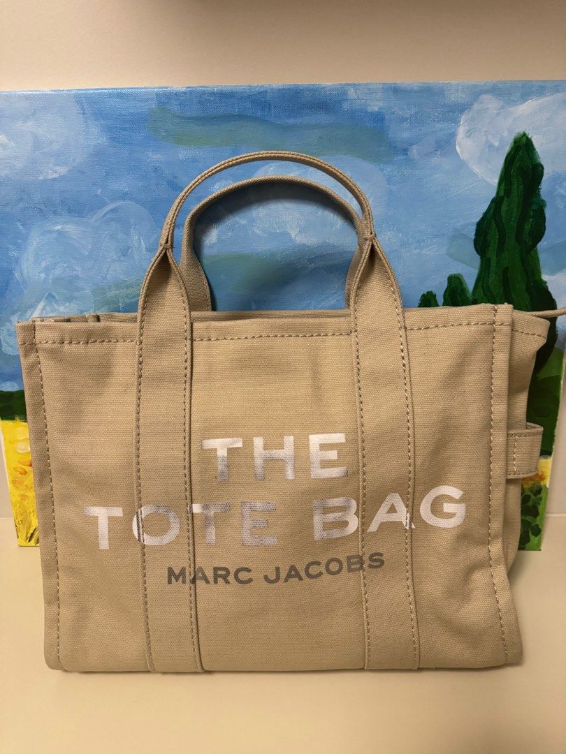 Marc Jacobs The Tote Bag Medium in Canvas (Category: Luxury Bags & Wallets) located in Bulacan. Submitted by krycrez (Listing ID 1264797261, Image 1). Description: Selling my preloved Marc Jacobs The Tote Bag in canvas. Has flaws (please see picture) 13in L x 6in D x 11in H 34cm L x 15cm D x 27cm H Strap 57in L x 2in D (144cm L x 4cm D) Strap Drop 27in (69cm) Handle Drop 5in (12cm).