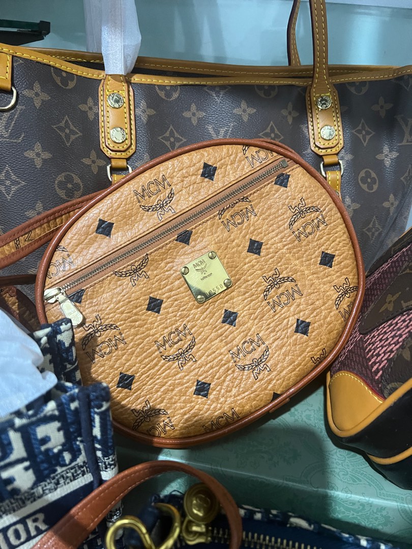 MCM ROUND BAG SLING, Luxury, Bags & Wallets on Carousell