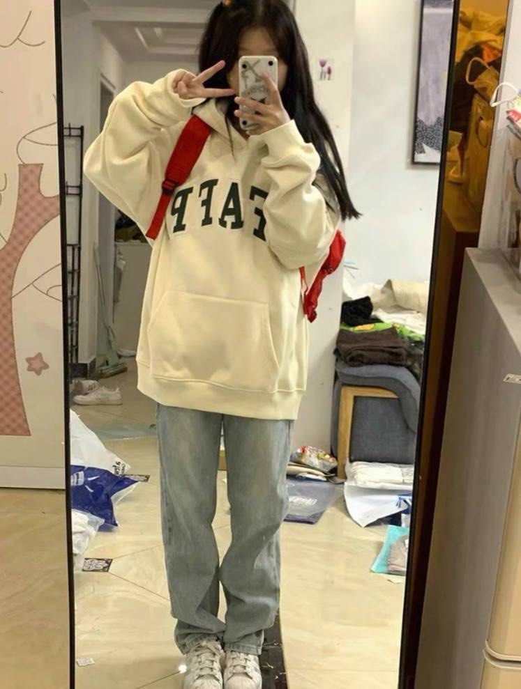 Girl wearing oversized hoodie top