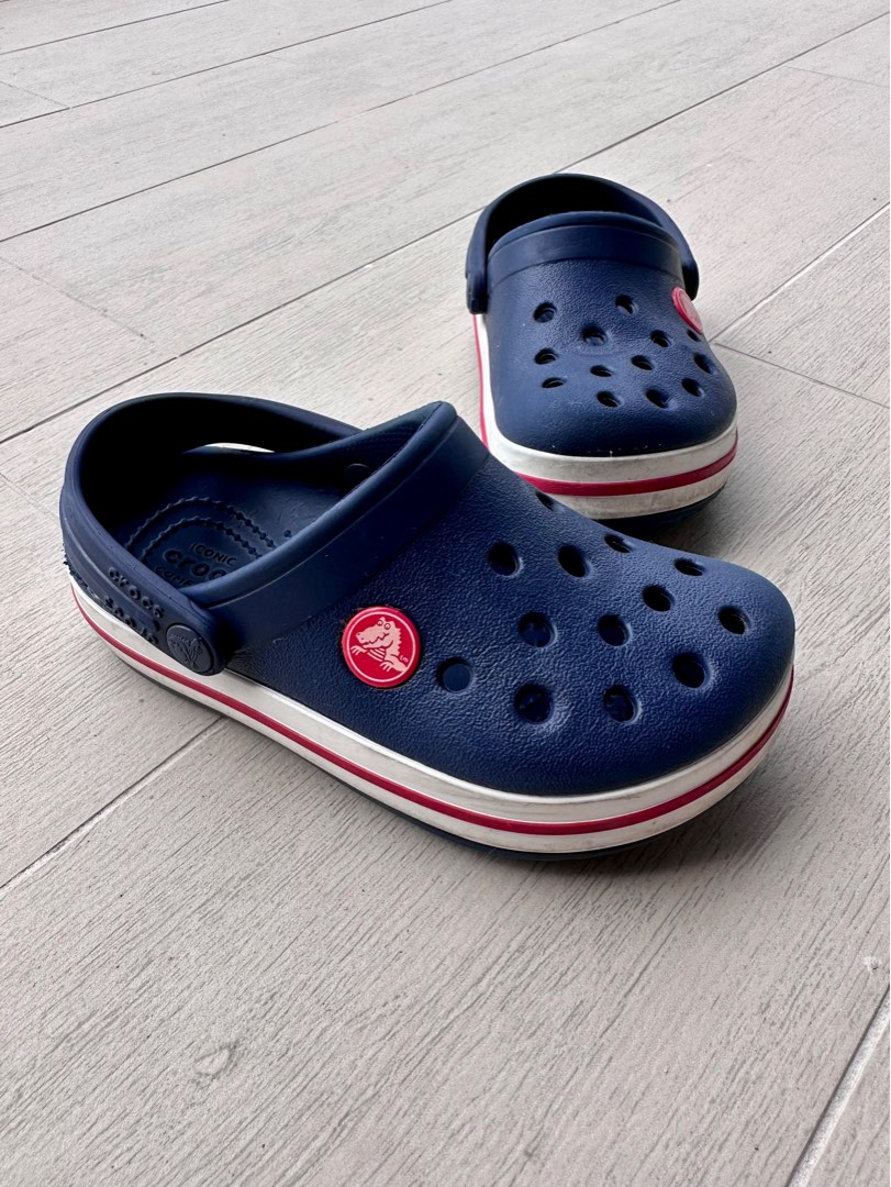 Blue crocs hot sale with red stripe