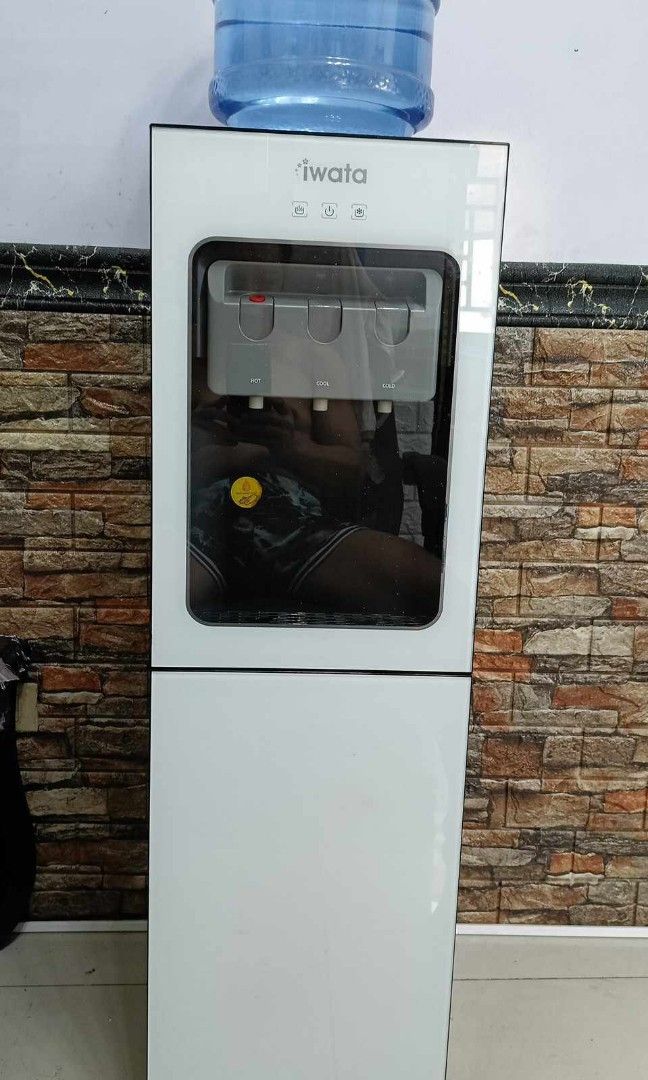 IWATA HOT & COLD WATER DISPENSER W/ STORAGE (Category: Pitchers & Dispensers) located in Manila. Submitted by melygregorio (Listing ID 1265019550, Image 1). Description: Hot and cold water dispenser with drink storage/cabinet..