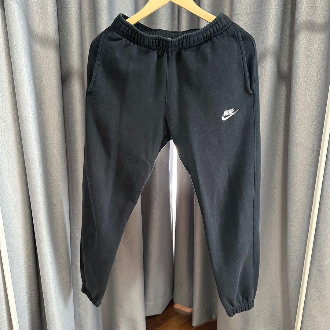Nike swoosh cuffed online sweatpants in black
