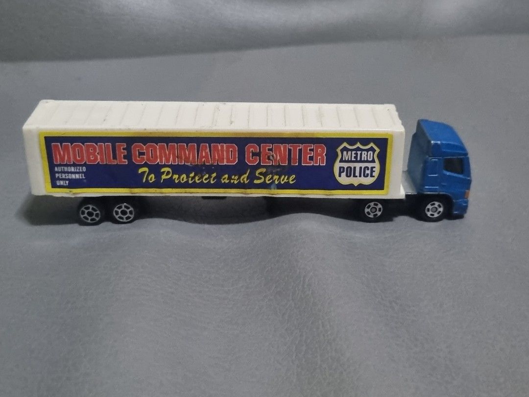 Tomica Hino Profia w/ trailer mobile command center (Category: Vehicle & Diecast Models) located in Silang. Submitted by samflores2k4t7 (Listing ID 1265118752, Image 2). Description: for sale Tomica Hino Profia no. 77 w/ trailer mobile command center (plastic) 2004 Tomy played condition with paintchip & scratches repaired trailer connector (replaced w/ screw).