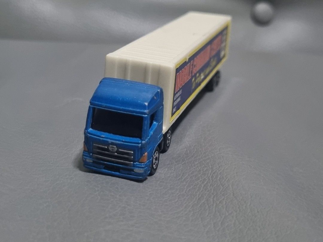 Tomica Hino Profia w/ trailer mobile command center (Category: Vehicle & Diecast Models) located in Silang. Submitted by samflores2k4t7 (Listing ID 1265118752, Image 3). Description: for sale Tomica Hino Profia no. 77 w/ trailer mobile command center (plastic) 2004 Tomy played condition with paintchip & scratches repaired trailer connector (replaced w/ screw).