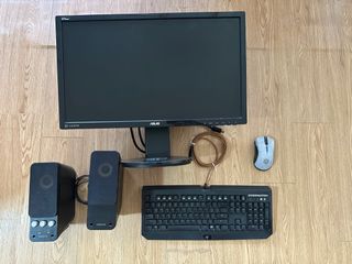 24-inch computer monitor with built-in speakers, keyboard, and mouse