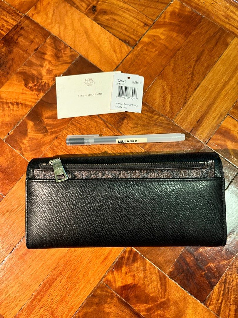Coach wallet and coin purse (Category: Luxury Bags & Wallets) located in Paranaque City. Submitted by obeawan (Listing ID 1265240494, Image 2). Description: Authentic coach wallet with removable coin purse. Care card and tag still there for proof of authenticity but no more box or pouch. Dimensions: L 8in x H 4in x W 1-1.5in Pen for size reference With minor flaws - cracks on the flap of the leather inside (seen on 5th and 6th picture) but not se