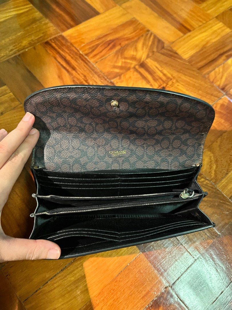 Coach wallet and coin purse (Category: Luxury Bags & Wallets) located in Paranaque City. Submitted by obeawan (Listing ID 1265240494, Image 3). Description: Authentic coach wallet with removable coin purse. Care card and tag still there for proof of authenticity but no more box or pouch. Dimensions: L 8in x H 4in x W 1-1.5in Pen for size reference With minor flaws - cracks on the flap of the leather inside (seen on 5th and 6th picture) but not se