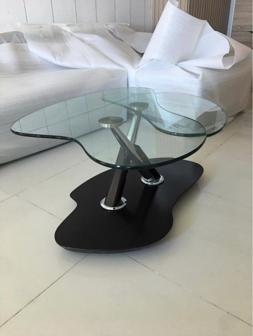 Contemporary Swiveling Table (Category: Tables & Sets) located in Mandaluyong City. Submitted by richdalekun (Listing ID 1265315850, Image 3). Description: Contemporary design Expandable glass center Orig price 30K Table base dimension (approx) length: 1.5ft width: 1ft Table glass top dimension (approx) the glass top expands when you move it so the length may vary length: 1.75 ft width: 1. 5 ft Selling this piece because downsizing..