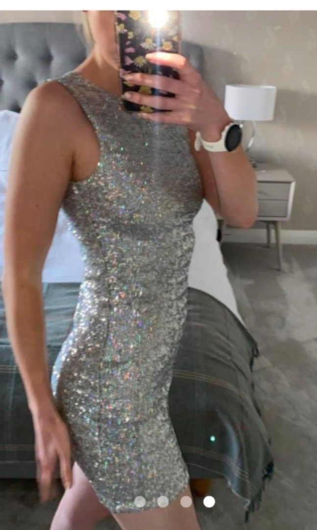 Topshop Sequins dress (Category: Dresses) located in Malabon City. Submitted by luckyfive (Listing ID 1264612760, Image 2). Description: Topshop sequins silver iridescent multi color dress, in excellent condition labelled UK 10, fits S-M more items listed everyday discount on multiple purchase follow me and get extra 5% discount, 10% to repeat customer.