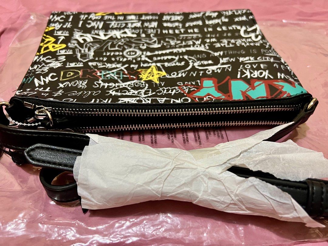 Authentic DKNY Double Zip Cross -body Bag (Category: Luxury Bags & Wallets) located in Las Pinas. Submitted by myluckyeight (Listing ID 1265522972, Image 2). Description: Authentic and brand new with tags Double zip with middle compartment Silver hardware Graffiti design .