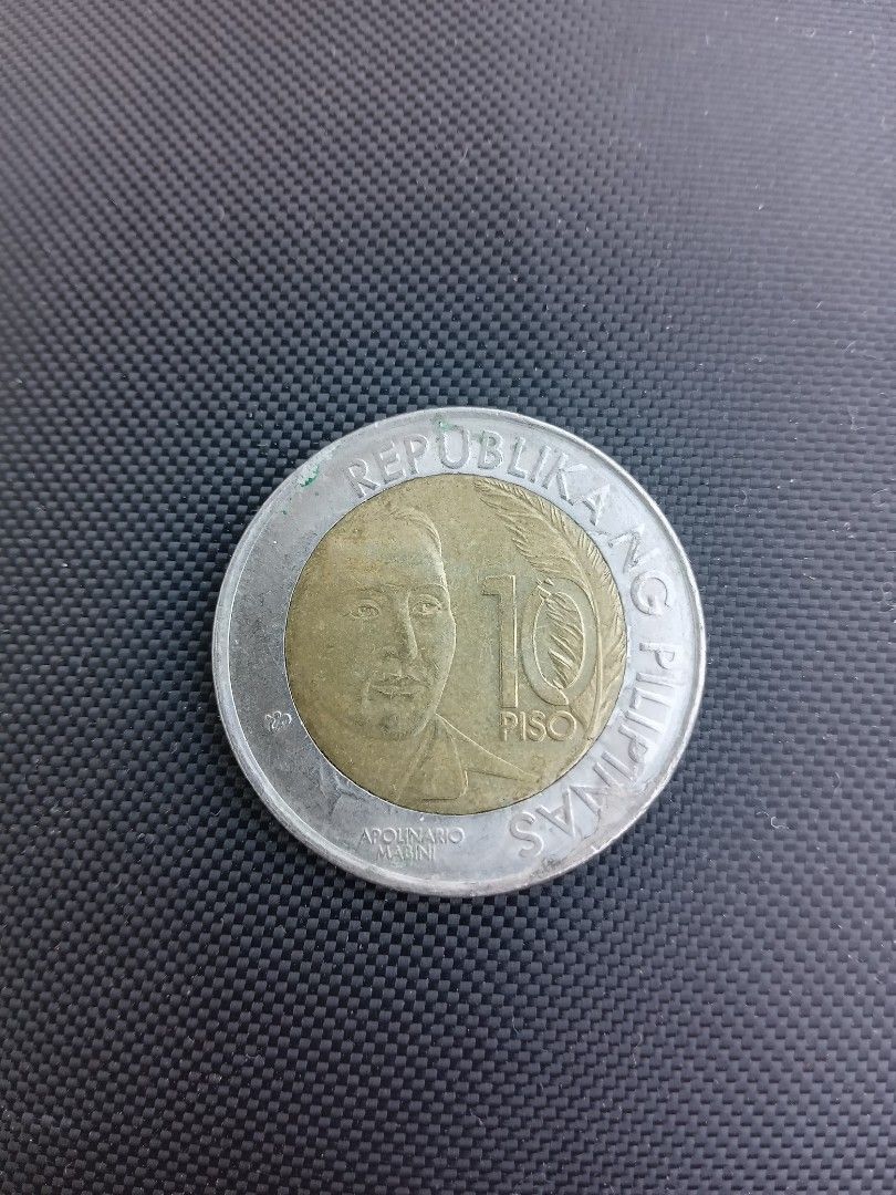 10-piso Apolinario Mabini coin (Category: Currency) located in San Pedro. Submitted by ohyeahph (Listing ID 1265624904, Image 3). Description: 10-piso coin Apolinario Mabini 150th birth anniversary, 1864-2014..