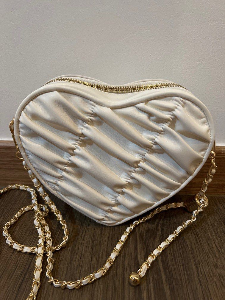 Charles and Keith crossbody heart shaped bag in white
