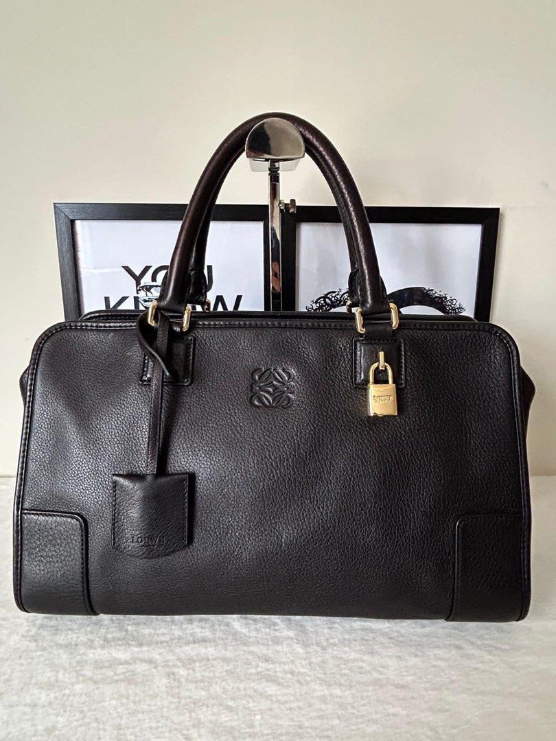 Loewe Amazona 36 Boston Bag (Category: Luxury Bags & Wallets) located in Manila. Submitted by bagislifeshop (Listing ID 1265693503, Image 2). Description: ☑️Available in Pampanga ✅Condition: 8.5/10 ✅Material: Calf leather ✅Size: 22 x 36 x 15cm ✅Colour: Black in GHW ✅Inclusions: Dustbag .