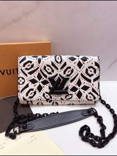 LOUIS VUITTON Graphic Print Leather Twist Wallet on Chain
