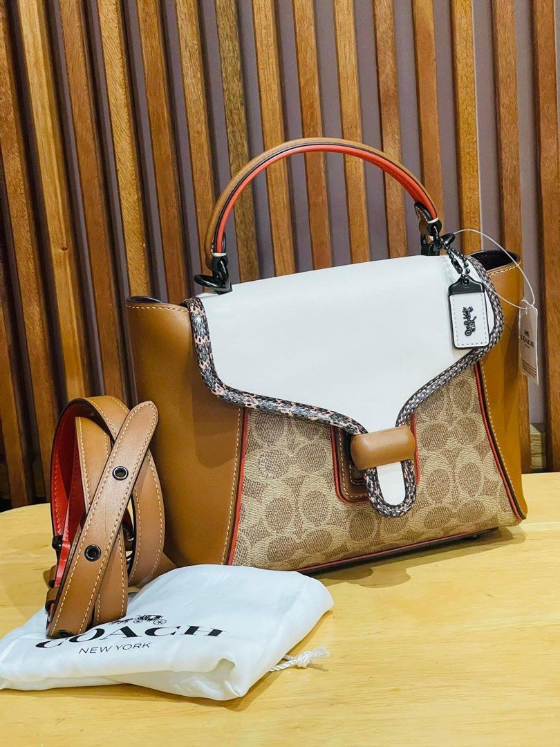 Courier carryall store with snakeskin detail