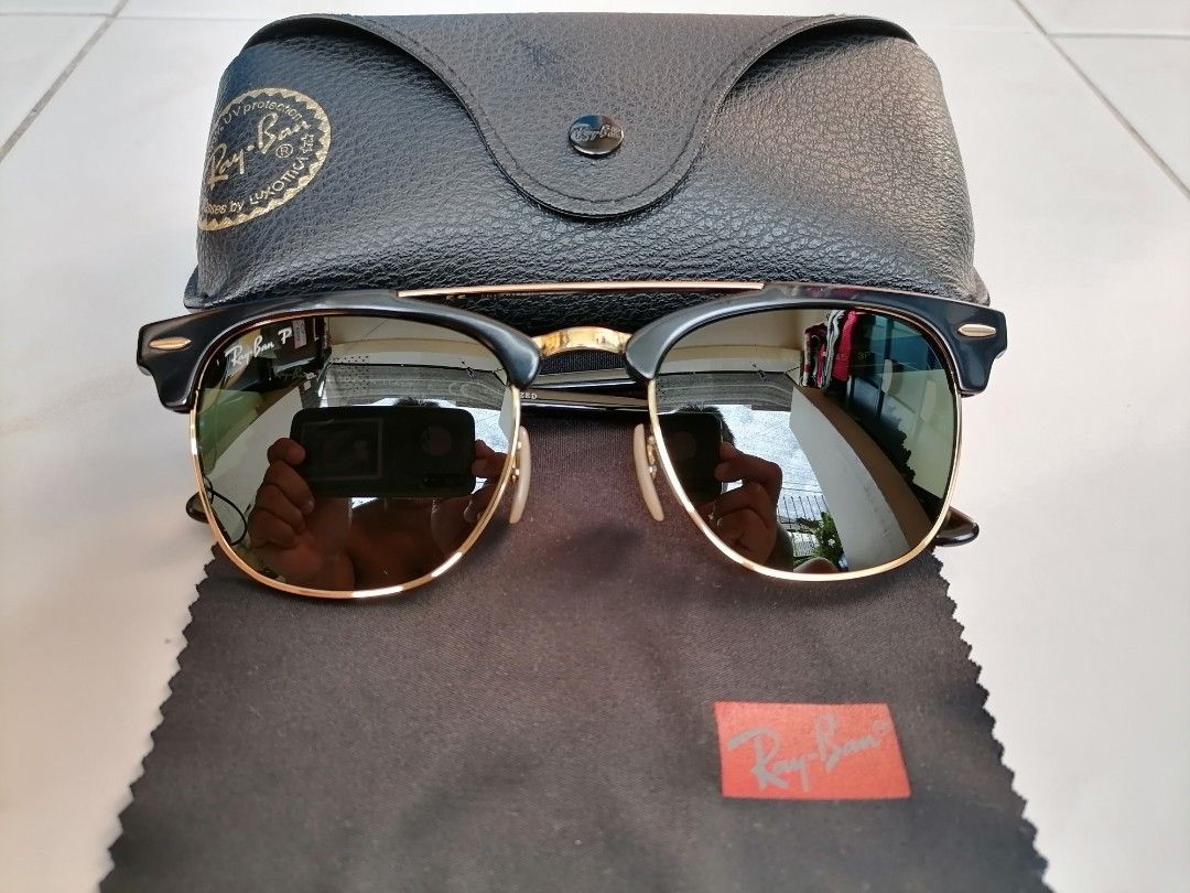 Rayban Clubmaster Polarized (Category: Sunglasses & Eyewear) located in Quezon City. Submitted by jongloyd (Listing ID 1265559990, Image 1). Description: For Sale NEGOTIABLE or SWAPPING/PALIT to RayBan WAYFARER Must be: 1. POLARISED, 2. Color- TORTOISE, 3. Size- 49 to 50 No Issues. Pre Loved. Well Used and kept. Special Features: 1. POLARISED. 2. Size-51. 3. Complete with Original Leather Case and Original Rayban Cleaning Cloth. 4. Color-Shiny Eb