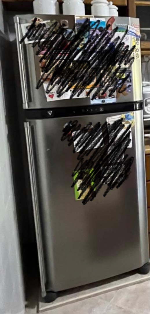 Free, well used Sharp refrigerator, still in working condition, pick up