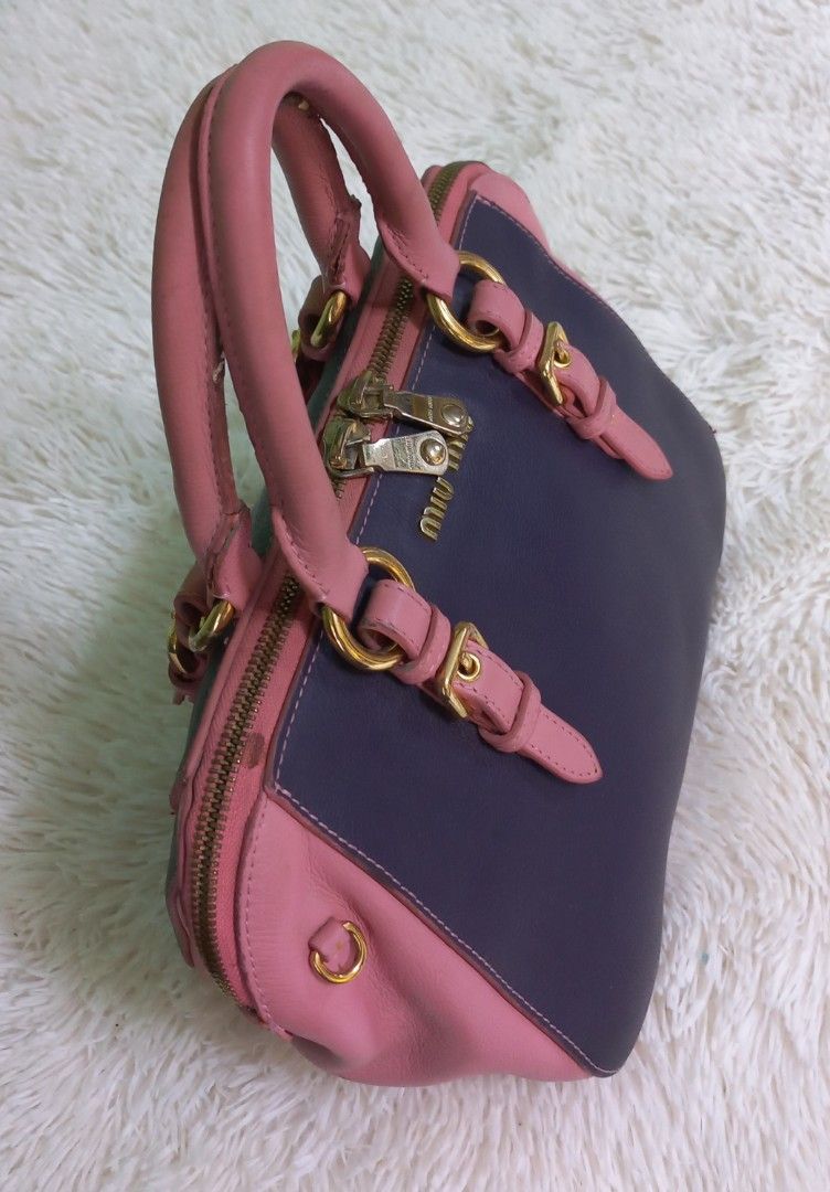 Miu miu (Category: Luxury Bags & Wallets) located in Cebu City. Submitted by MrLiks_123 (Listing ID 1265758973, Image 3). Description: Authentic Miumiu Madras goat leather top-handle bag pink/purple No major flaw's Sign of used in handle please see pic In great condition Rank ab to manage your expectation 9/10 overall condition.