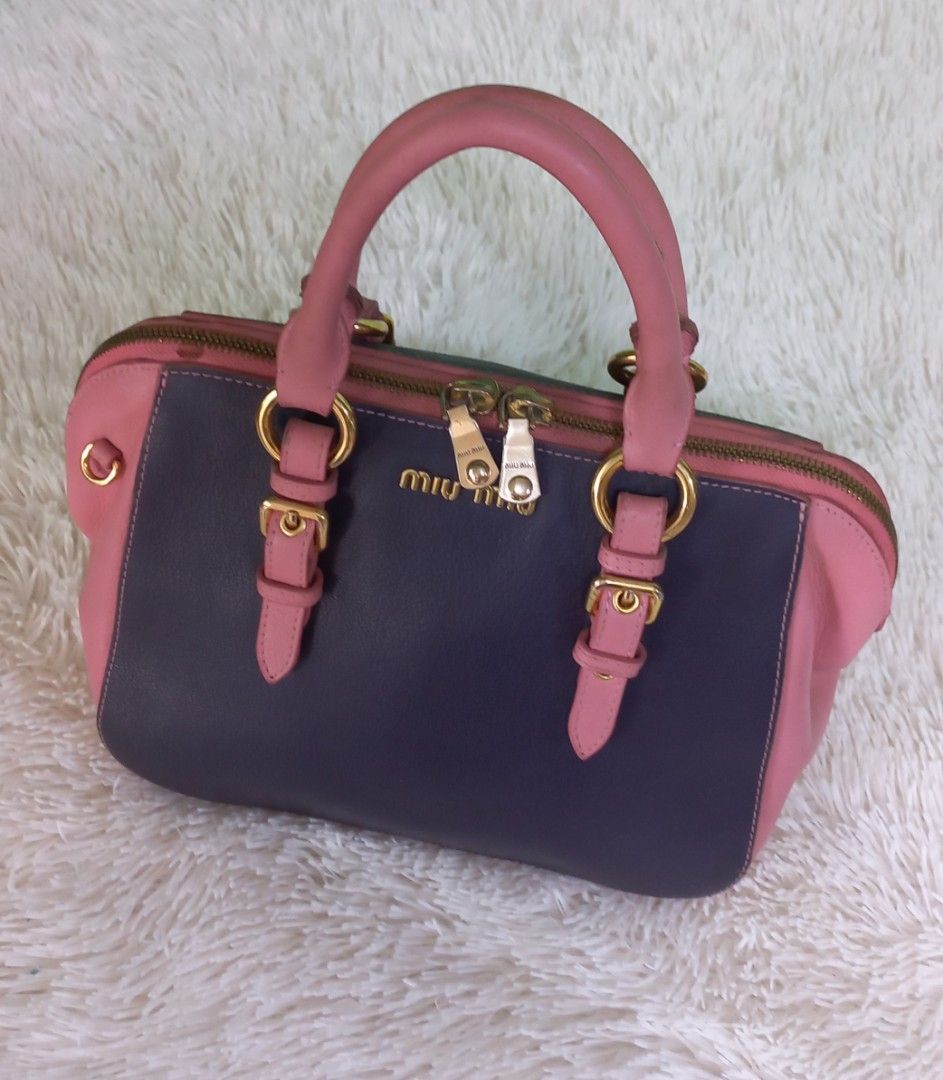 Miu miu (Category: Luxury Bags & Wallets) located in Cebu City. Submitted by MrLiks_123 (Listing ID 1265758973, Image 2). Description: Authentic Miumiu Madras goat leather top-handle bag pink/purple No major flaw's Sign of used in handle please see pic In great condition Rank ab to manage your expectation 9/10 overall condition.
