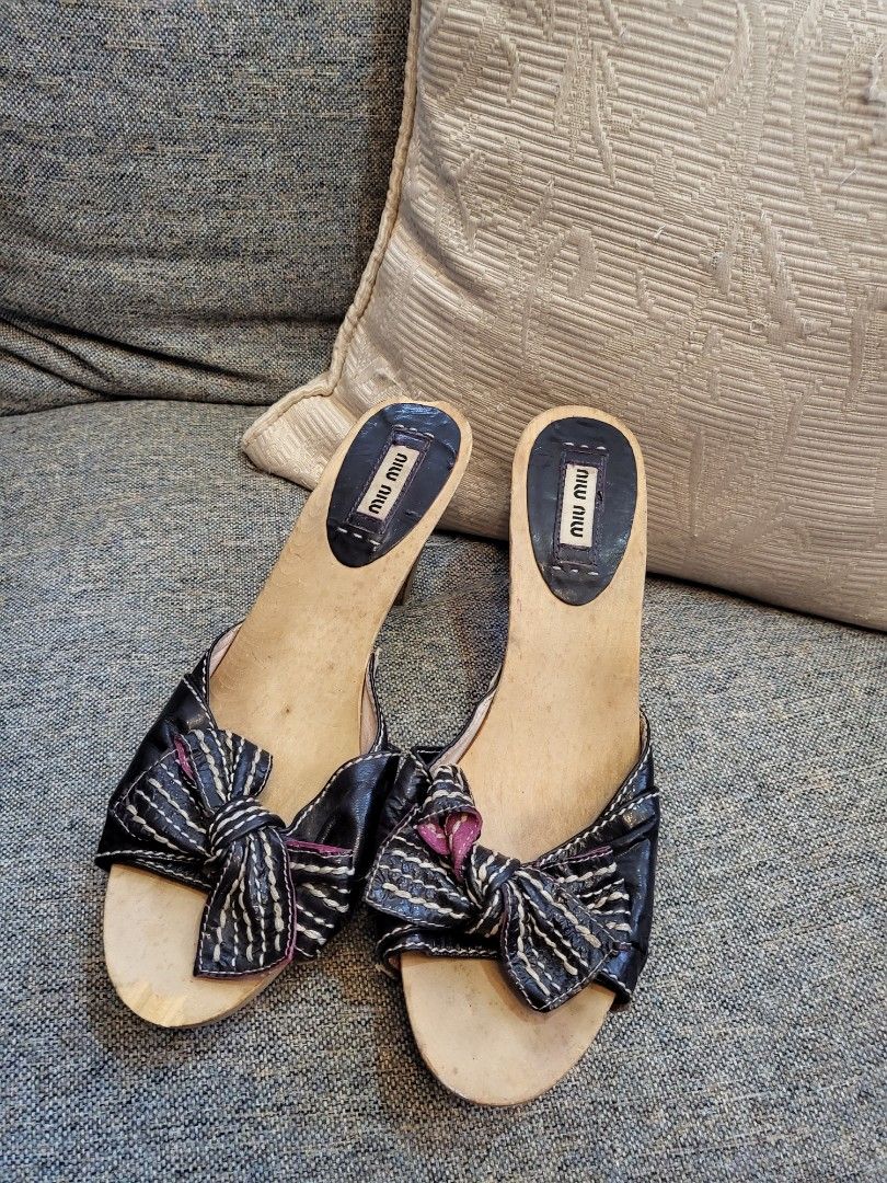 Miumiu Vintage Clogs (Category: Flats & Sandals) located in Cebu City. Submitted by purseandshoeaddictcebu (Listing ID 1265903045, Image 1). Description: Authentic MiuMiu Wooden Clogs US size 8 Signs of use *wood chip in front and back see photo reference RFS: No longer fits me #everyonewins.
