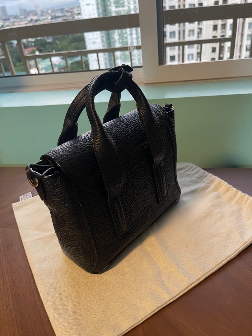 Phillip Lim black mini pashli (Category: Luxury Bags & Wallets) located in Quezon City. Submitted by klosetmanila (Listing ID 1265905485, Image 2). Description: With strap and cards only.