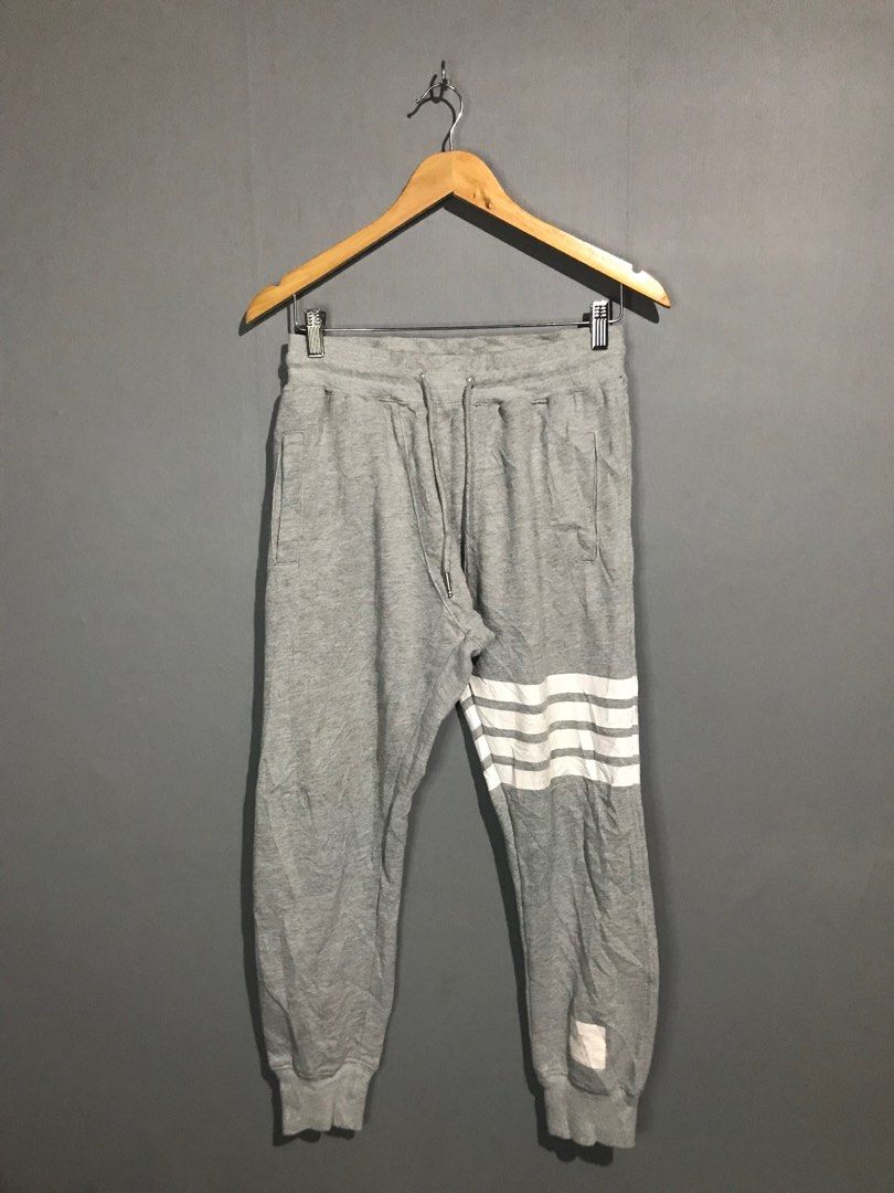Thom Browne Loopback Knit Engineered 4-Bar Sweatpants (Category: Joggers) located in Santa Cruz. Submitted by hongkongmarketph (Listing ID 1265746432, Image 1). Description: Thom Browne Loopback Knit Engineered 4-Bar Sweatpants In Gray very good condition minimal sign of usage on print see last two photos 28-32 waist length 36.