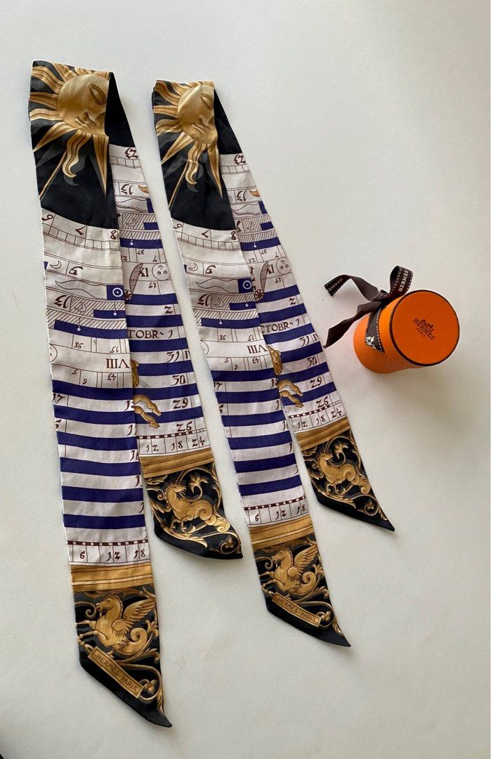 96% NEW HERMES TWILLY PAIR (Category: Luxury Accessories) located in Taguig. Submitted by sweetluxuryph (Listing ID 1266076611, Image 1). Description: 💯 GUARANTEED AUTHENTIC ✨17,000✨ pair DIÊS ET HORE Astrology Motif Black /Purple / Gold / White Dimensions-32”x2” Mint Condition, Rank A Comes w/ Boxes & Ribbon .