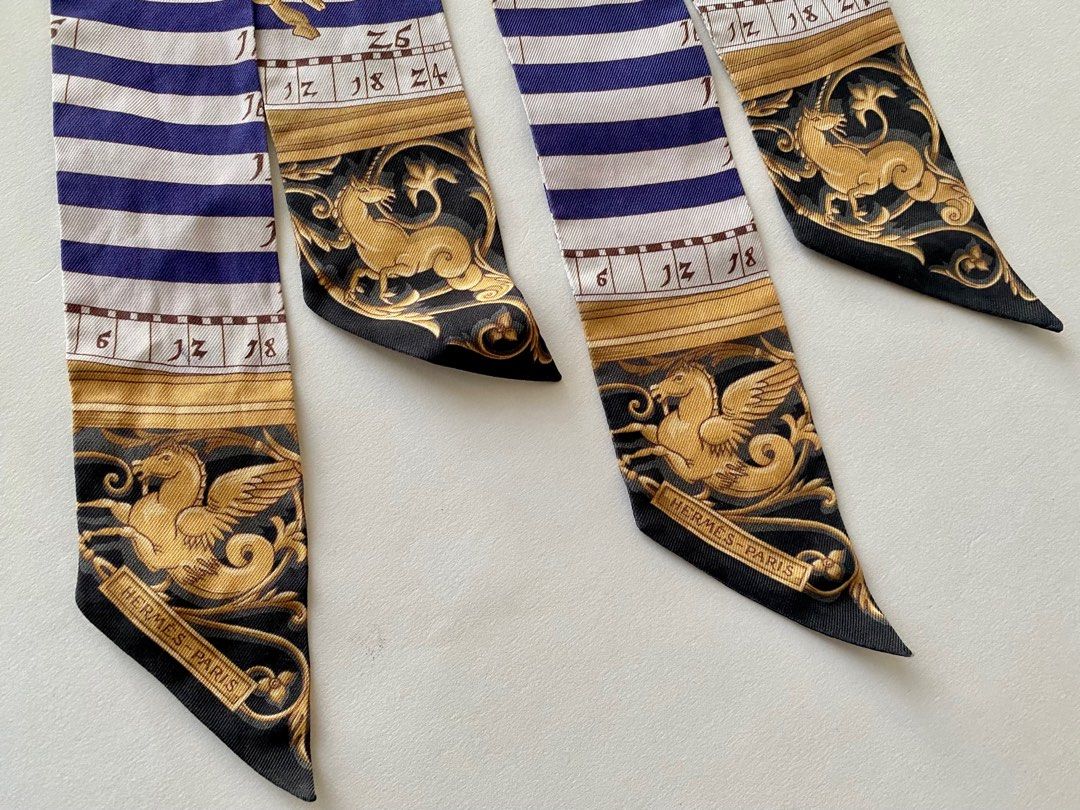 96% NEW HERMES TWILLY PAIR (Category: Luxury Accessories) located in Taguig. Submitted by sweetluxuryph (Listing ID 1266076611, Image 3). Description: 💯 GUARANTEED AUTHENTIC ✨17,000✨ pair DIÊS ET HORE Astrology Motif Black /Purple / Gold / White Dimensions-32”x2” Mint Condition, Rank A Comes w/ Boxes & Ribbon .