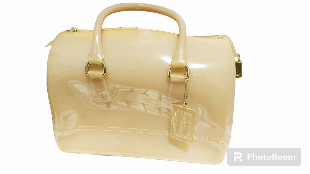 FURLA Candy Handbag (Category: Luxury Bags & Wallets) located in Quezon City. Submitted by glaminize (Listing ID 1266035563, Image 3). Description: Authentic Complete with lock, hang tag and dust bag. Color may be slightly darker in person. Free delivery via lalamove if within quezon city area only. .